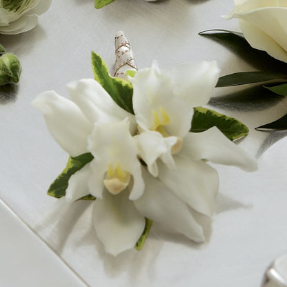 White Mini Cymbidium Boutonniere –  Unique Flowers And Wedding, Dania Beach FL